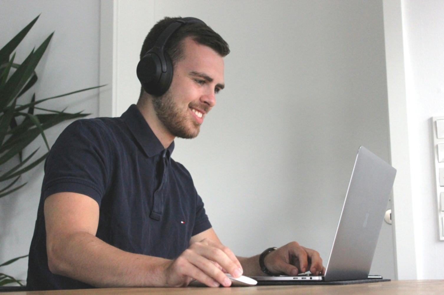 Person reviewing financial planning materials at a comfortable workspace
